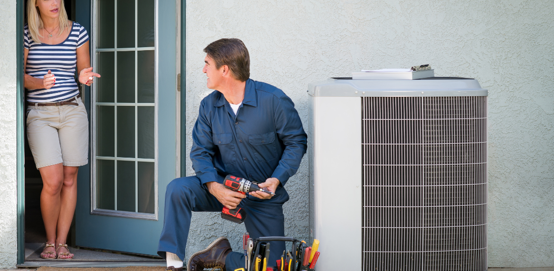 man repairing air conditioning for home