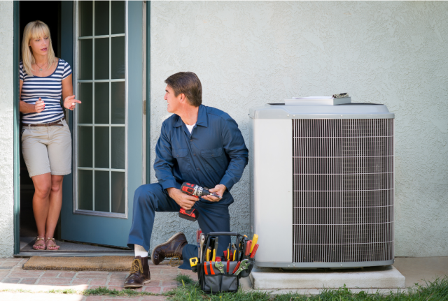 man repairing air conditioning for home